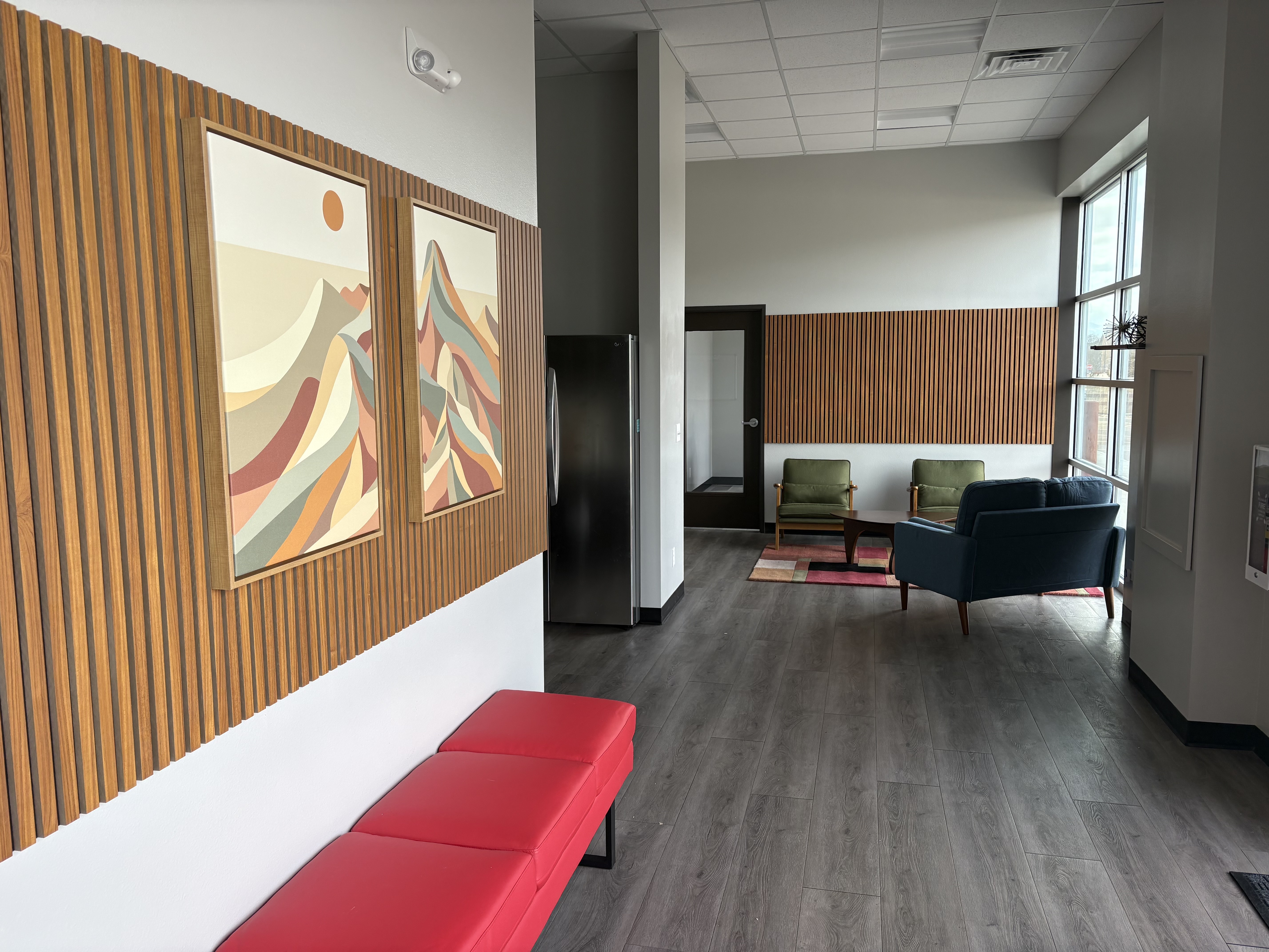 Mountain art and wood slat wall at Leaf Coworking